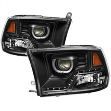 Load image into Gallery viewer, xTune Dodge Ram 2009-2014 Halo LED Projector Headlights - Black PRO-JH-DR09-CFB-BK