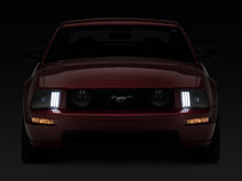 Load image into Gallery viewer, Raxiom 05-09 Ford Mustang w/ Halogen Prjctor Headlights- Black Housing (Clear Lens) (No GT500 )